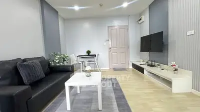 Modern living room with sleek furniture and stylish decor, perfect for comfortable living.