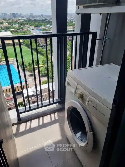 High-rise balcony with washing machine and stunning city view