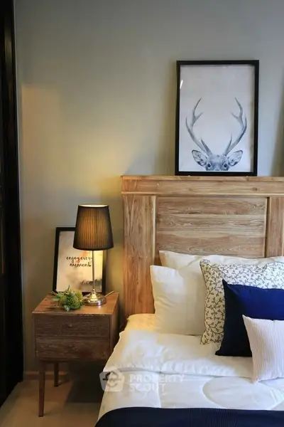 Cozy bedroom with stylish wooden headboard and elegant decor