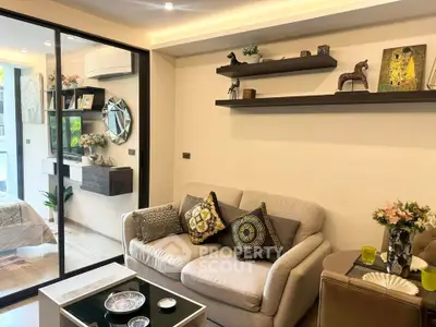 Stylish living room with modern decor and cozy seating in a contemporary apartment.
