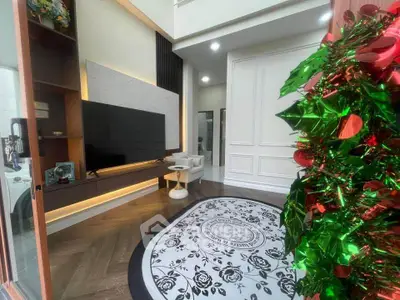 Stylish living room with modern decor and festive holiday decorations