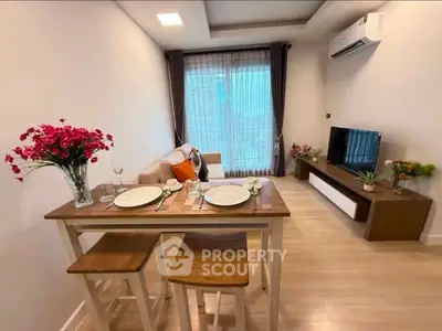 Modern living room with dining area, cozy sofa, and large window view.