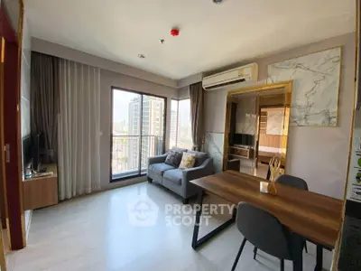 Modern living room with balcony view in high-rise apartment