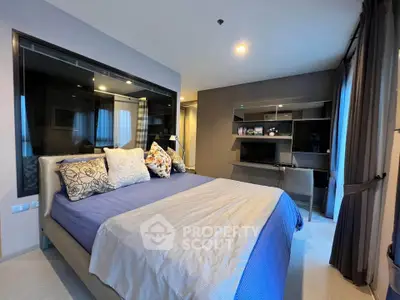 Modern bedroom with stylish decor and large window, featuring a comfortable bed and sleek shelving unit.