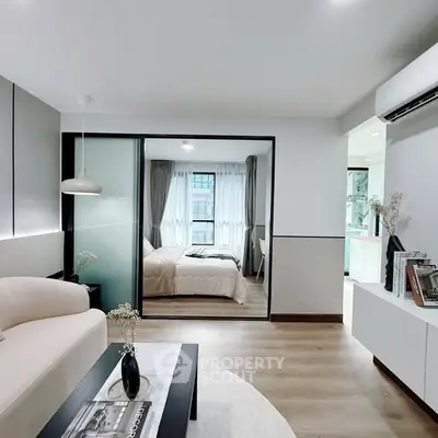 Modern living room with open view to cozy bedroom and stylish decor