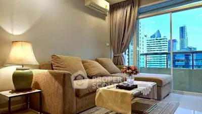 Modern living room with cozy sofa and city view balcony in high-rise apartment.