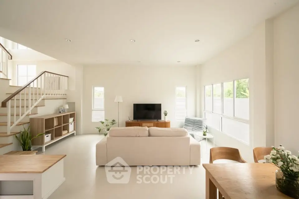 Spacious modern living room with natural light and elegant decor