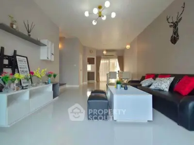 Spacious modern living room with stylish decor and ample natural light