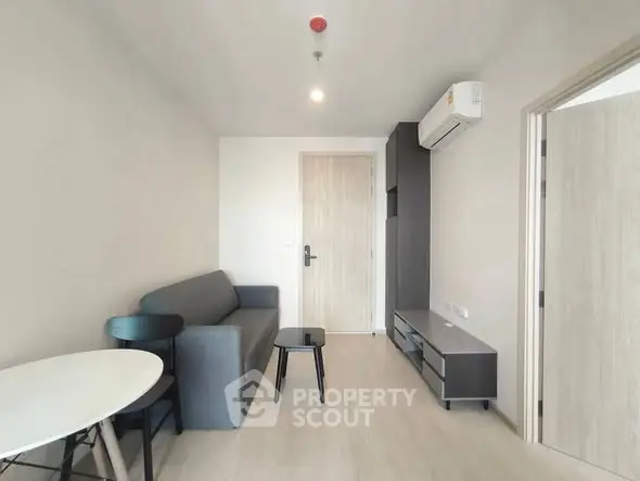 Modern living room with minimalist furniture and air conditioning