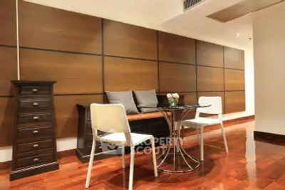 Elegant living room with modern furniture and wooden accents, perfect for stylish urban living.