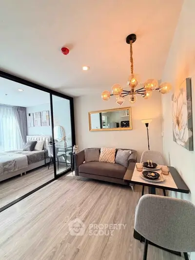 Modern living room with elegant decor and open layout, featuring stylish furniture and ambient lighting.