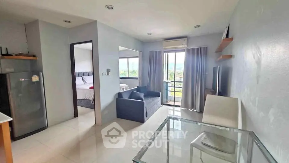 Modern apartment with open living area and scenic balcony view