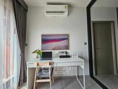Modern study room with sleek desk, laptop, and air conditioning in stylish apartment.