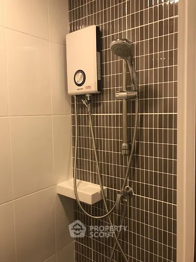 Modern bathroom with sleek shower design and stylish tile work.