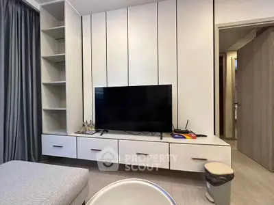 Modern living room with sleek TV unit and minimalist decor