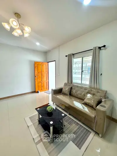 Spacious living room with modern decor and natural light