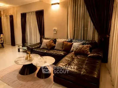 Luxurious living room with elegant leather sofa and chic marble coffee tables