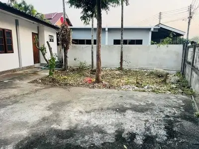 Spacious outdoor area with potential for landscaping in a residential property.