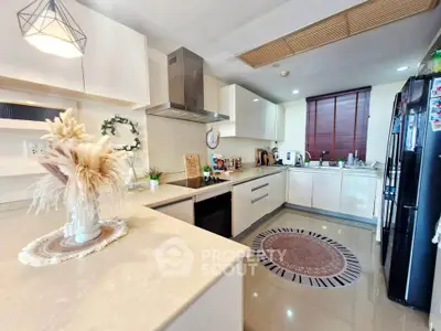 Modern kitchen with sleek cabinetry and stylish decor in a contemporary home.