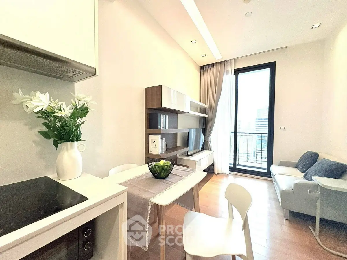 Modern living room with balcony, sleek furniture, and natural light.
