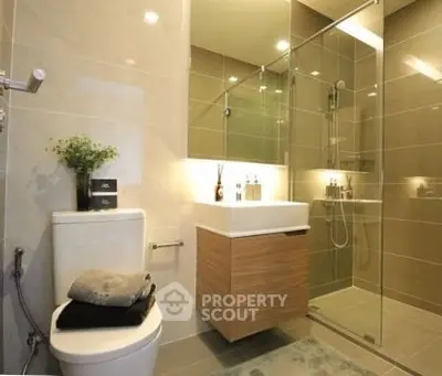 Modern bathroom with glass shower and sleek vanity