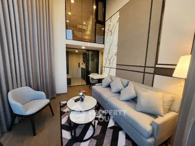 Modern living room with high ceiling and stylish decor in a luxury apartment