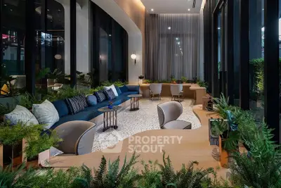 Luxurious modern living room with elegant seating and lush greenery