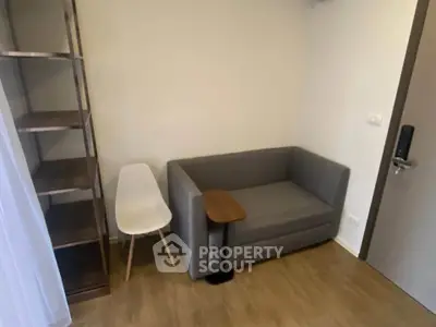 Cozy corner with modern sofa and shelving in a stylish apartment