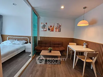 Modern studio apartment with cozy living area and stylish decor