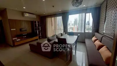 Spacious living room with city view and modern furnishings