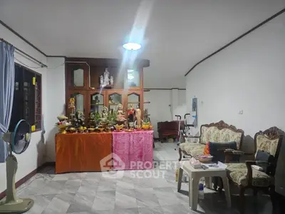 Spacious living room with traditional decor and ample natural light