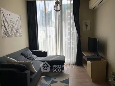 Modern living room with city view, stylish furniture, and natural light.