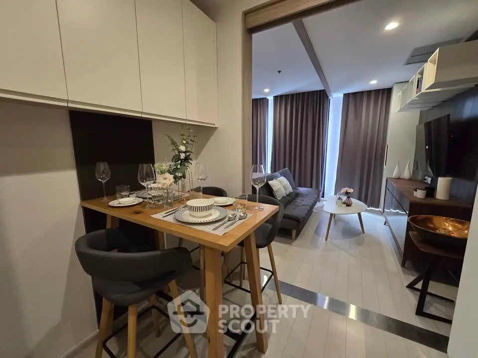 Modern living room with dining area and stylish decor in a cozy apartment.