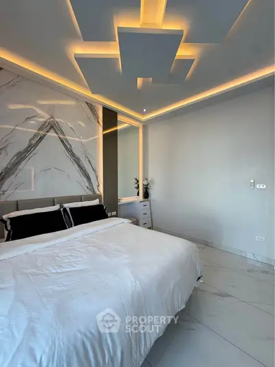 Luxurious modern bedroom with elegant marble accents and ambient lighting