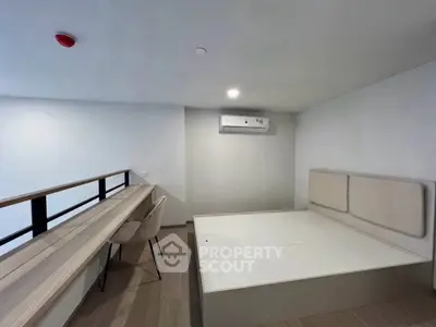 Modern minimalist bedroom with built-in desk and air conditioning