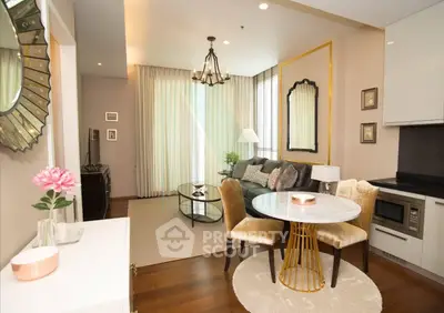 Elegant living room with modern decor, featuring a cozy dining area and stylish furnishings.
