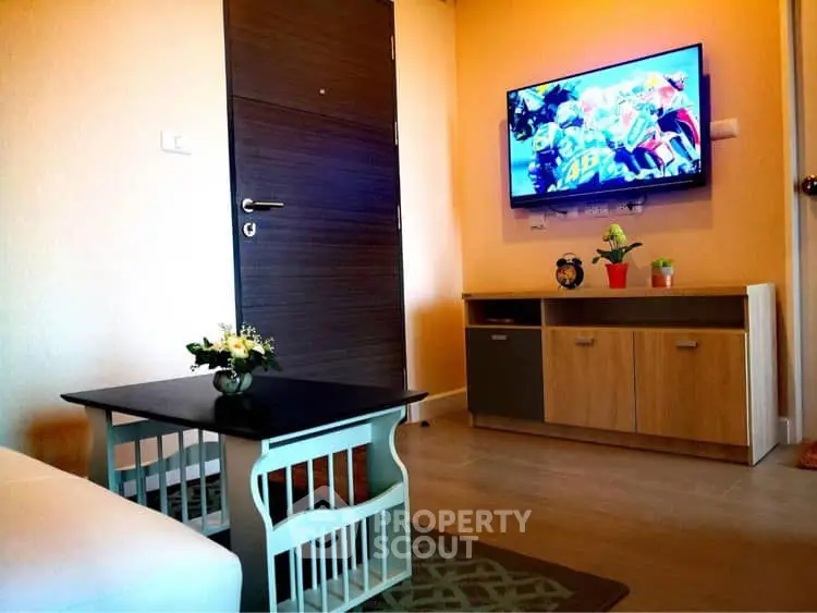 Cozy living room with modern decor and wall-mounted TV