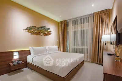 Luxurious modern bedroom with elegant decor and large window view.