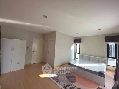 Spacious bedroom with modern design and ample natural light