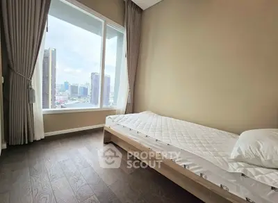 Modern bedroom with city view and minimalist design
