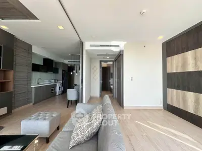 Modern open-plan living room with kitchen and stylish decor