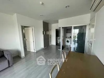 Modern apartment interior with open layout and in-unit laundry