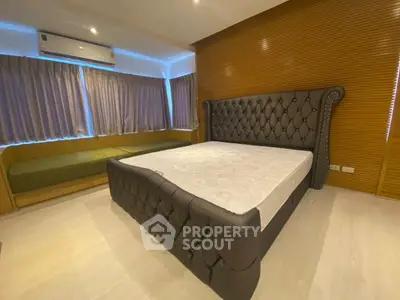 Luxurious bedroom with elegant leather bed and modern design