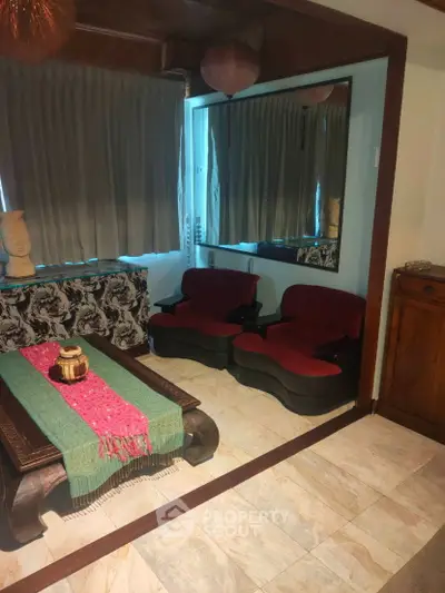 Cozy living room with unique furniture and warm decor