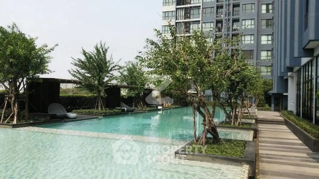 Luxurious condominium with stunning outdoor pool and lush greenery