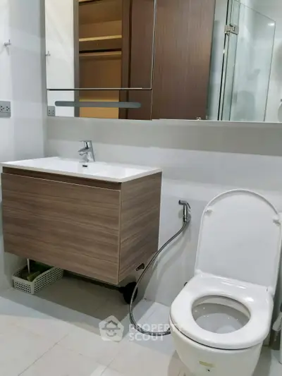 Modern bathroom with sleek fixtures and glass shower enclosure