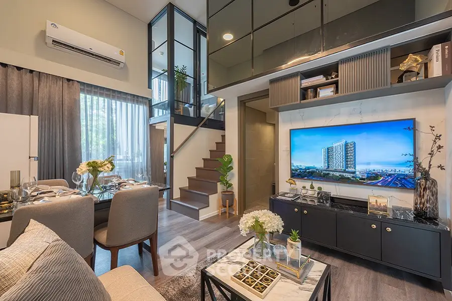 Modern living room with stylish decor and staircase in luxury apartment