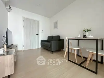 Modern living room with sleek furniture and minimalist decor in a cozy apartment.