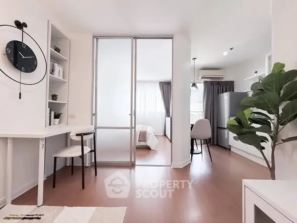 Modern open-plan apartment with stylish decor and natural light