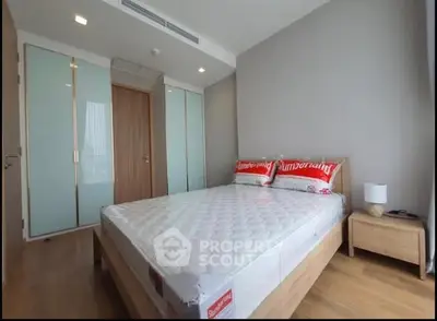 Modern bedroom with minimalist design and wooden flooring